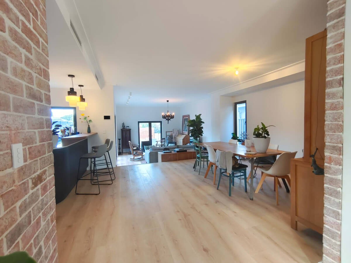 Mt Hawthorn Passiv Haus open plan living and dining with exposed brick walls